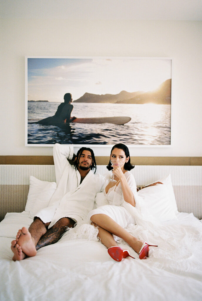 Bride and groom photographed in bed with martini at W Hotel Miami
