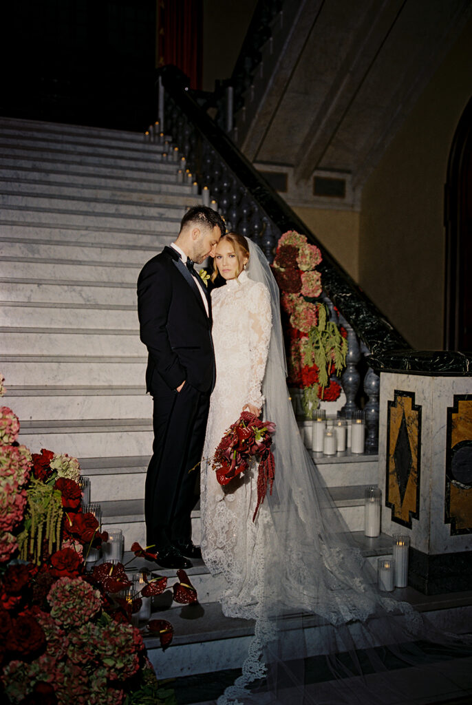 Bride and groom photographed on grand staircase Union Club, Cleveland.